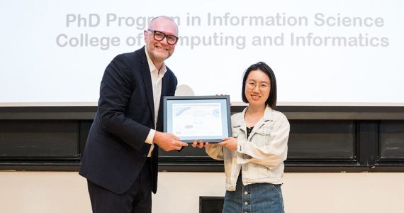 Drexel Emerging Scholars Conference 2022 Awardee, Hua Cui receiving her award at Graduate Student Day 2022